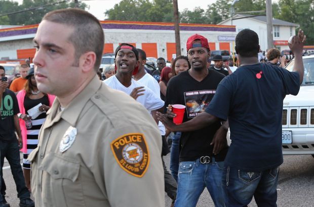 Protesters confront police